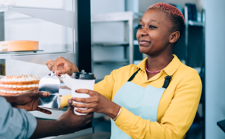 A barista serving a customer