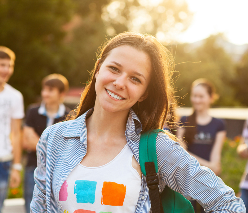 A photograph of a young woman smiling